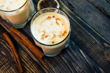 Yellow Indian mango yoghurt drink Mango Lassi or smoothie with turmeric and saffron.