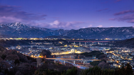 evening view of Japanese rural city and  mountains