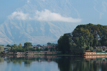 Fototapeta premium The landscapes of Houseboats, mountains and lakes at Nigeen lake in Srinagar, Kashmir, India