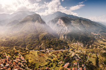 Aerial drone panoramic view of deep gorge and rocky ridge leading to legendary Mountain Olympus - the pantheon of all Greek gods and Great Zeus. Natural and National Parks in Greece - obrazy, fototapety, plakaty