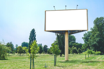 Blank billboard mockup with white screen. Against the backdrop of nature and blue sky. Business concept. Copy space banner for advertising.