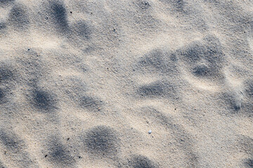 Close-up view of textured sand on a beach or in desert
