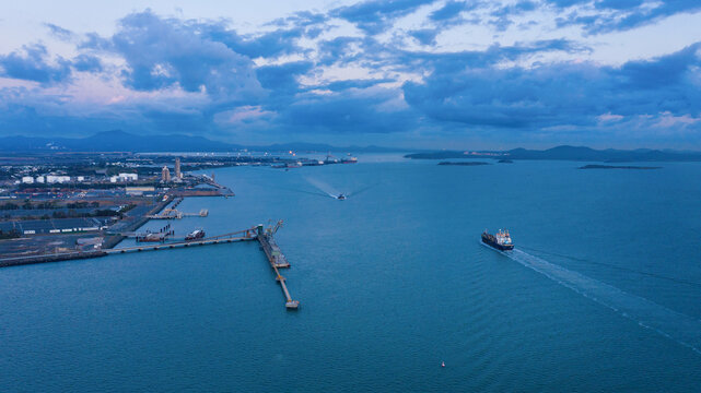 Horizontal shot of a port and ships sailing