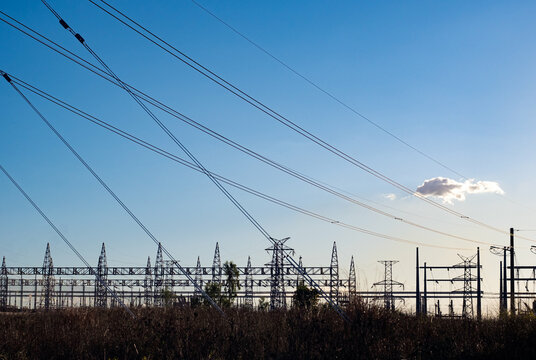 Horizontal shot of power lines at sunset