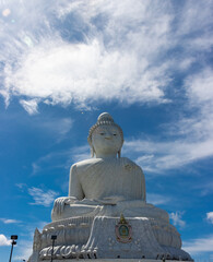 Fototapeta premium Big Buddha lovely large statue made from white marble on top of mountain in Phuket Thailand