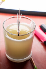 Melted Soy wax poured in candle glass jar.
