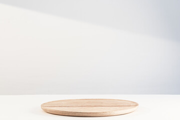 Wooden dish on white. Food or product podium