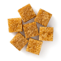 Brown sugar cubes isolated on white background, top view