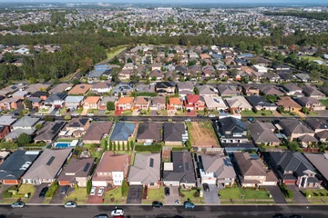 Poster Aerial view of houses in outer suburban Sydney, Australia © Harley Kingston