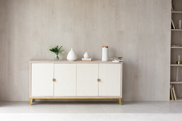 White modern dresser minimalistic furniture in empty room on grey wall background, small cupboard...