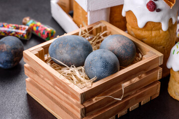 Festive cakes with white glaze, nuts and raisins with Easter eggs on the festive table