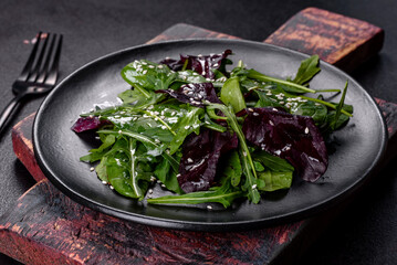 Fresh delicious salad with sleeves, spinach and beet leaves with olive oil