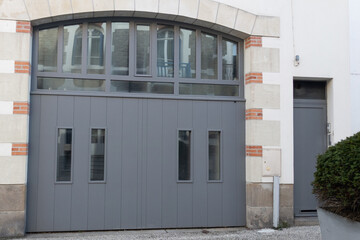 modified garage door modern urban real estate home facade with designer front entrance of the house