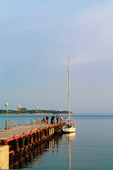 People stand at yacht