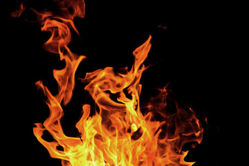 Fototapeta na wymiar Close up burning flames on black background for graphic design or wallpaper