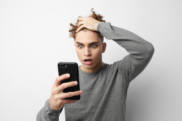kinky guy looking at the phone fashion isolated background