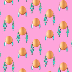 Pattern made of Easter eggs and green earrings on a pastel pink background. Minimum holiday concept 2022.