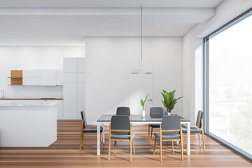 Modern dining room interior, panoramic window, large glass table with 6 chairs. Stylish kitchen. hardwood flooring. White open space area. 3d rendering.