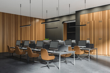 Corner view on dark office room interior with desktops