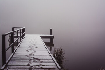 Pontoon in lake with snow