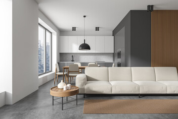 Dark kitchen room interior with sofa, coffee table, dining table