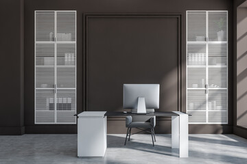 Front view on dark office interior with empty brown wall