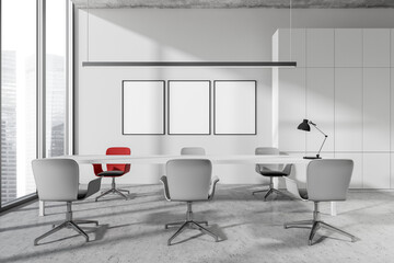 Business room interior with seats and table, lamp and window, mockup posters