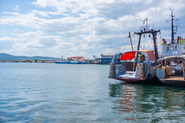 Sea pier, ship moored to the pier