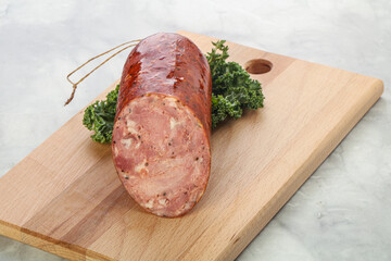 Pork ham sausage over board