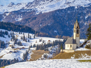 La valle La val dolomites mountain church in winter