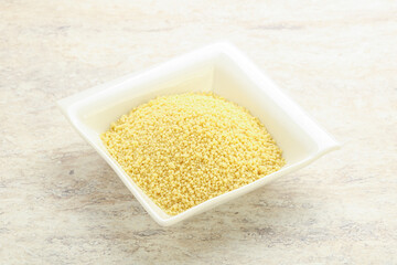 Raw couscous in the bowl