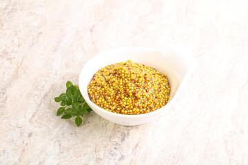 Grain mustard sauce in the bowl