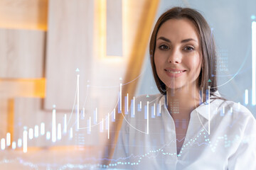 Portrait of attractive smiling businesswoman in formal wear thinking how to optimize trading strategy at corporate finance fund. Forex chart hologram over modern office background