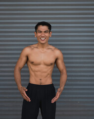 Obraz premium Young man with fit and firm muscle