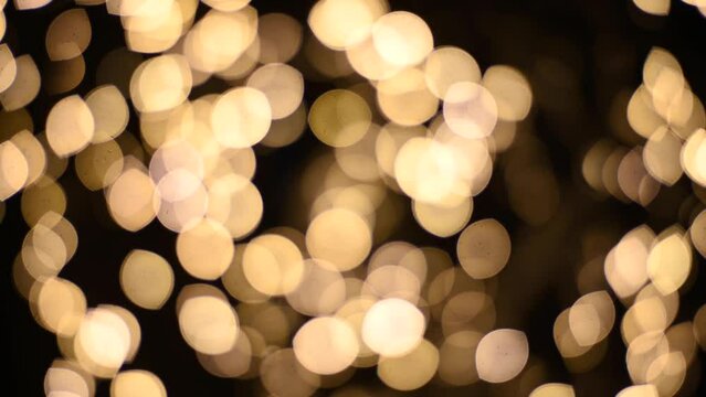 Abstract blurry, low depth of field bokeh light shapes. Vivid, colourful light effects, 4K background video clip with different shapes and dots in various colours. Perfect for Christmas backgrounds