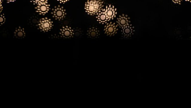 Abstract blurry, low depth of field bokeh light shapes. Vivid, colourful light effects, 4K background video clip with different shapes and dots in various colours. Perfect for Christmas backgrounds