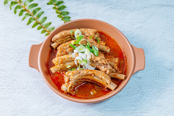 Deunggalbijjim, Korean Braised Pork Rib : For this dish, pig backbone is braised with mukeunji (aged kimchi). After being seasoned and simmered in broth, the mukeunji becomessoft and savory.
