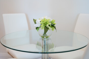 Flowers in the vase  on table  interior decorations 
