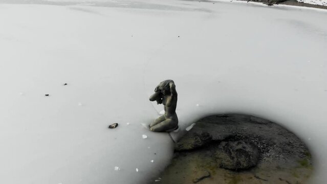 view of Lake Karesse in Val di Fassa Dolomites in winter with snow 4k