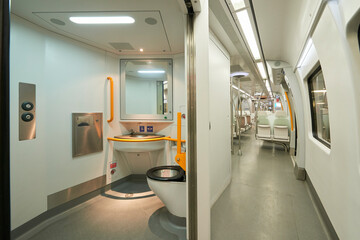 View of the toilets and corridor in a modern train without people