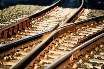 Railway crossing and traffic light in orange backlight