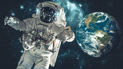 Astronaut spaceman do spacewalk while working for spaceflight mission at space station . Astronaut wear full spacesuit for operation . Elements of this image furnished by NASA space astronaut photos .
