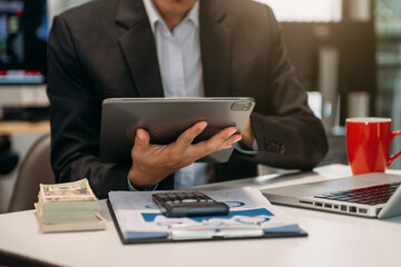 Business man working at office with laptop and documents on his desk new start up project.