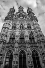 Black and white frontal perspective. Travel photograph, street view in a beautiful sunny September day with some clouds, Leuven, Belgium