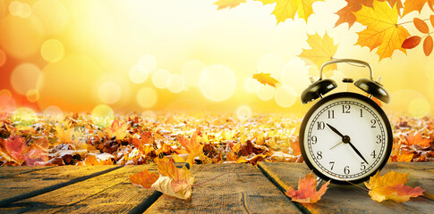 Naklejka na ściany i meble Daylight time saving concept. Autumn time. Copy space.