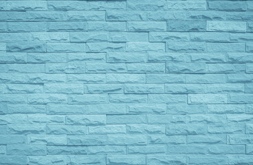 Obraz premium Brick wall painted with pale blue paint pastel calm tone texture background. Uneven bricks design stack backdrop.
