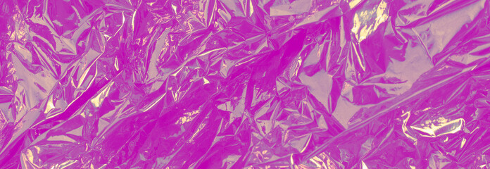 Shiny crumpled metallic pink foil background. Banner.