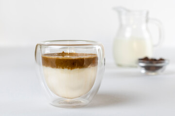 Cold dalgona coffee. Whipped instant coffee. Popular coffee. Latte espresso with coffee foam in a glass.