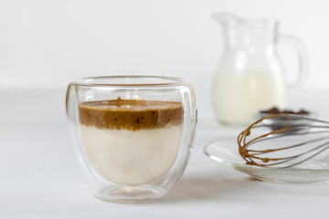 Cold dalgona coffee. Whipped instant coffee. Popular coffee. Latte espresso with coffee foam in a glass.