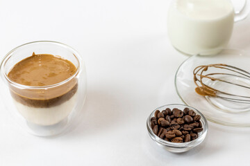 Cold dalgona coffee. Whipped instant coffee. Popular coffee. Latte espresso with coffee foam in a glass.